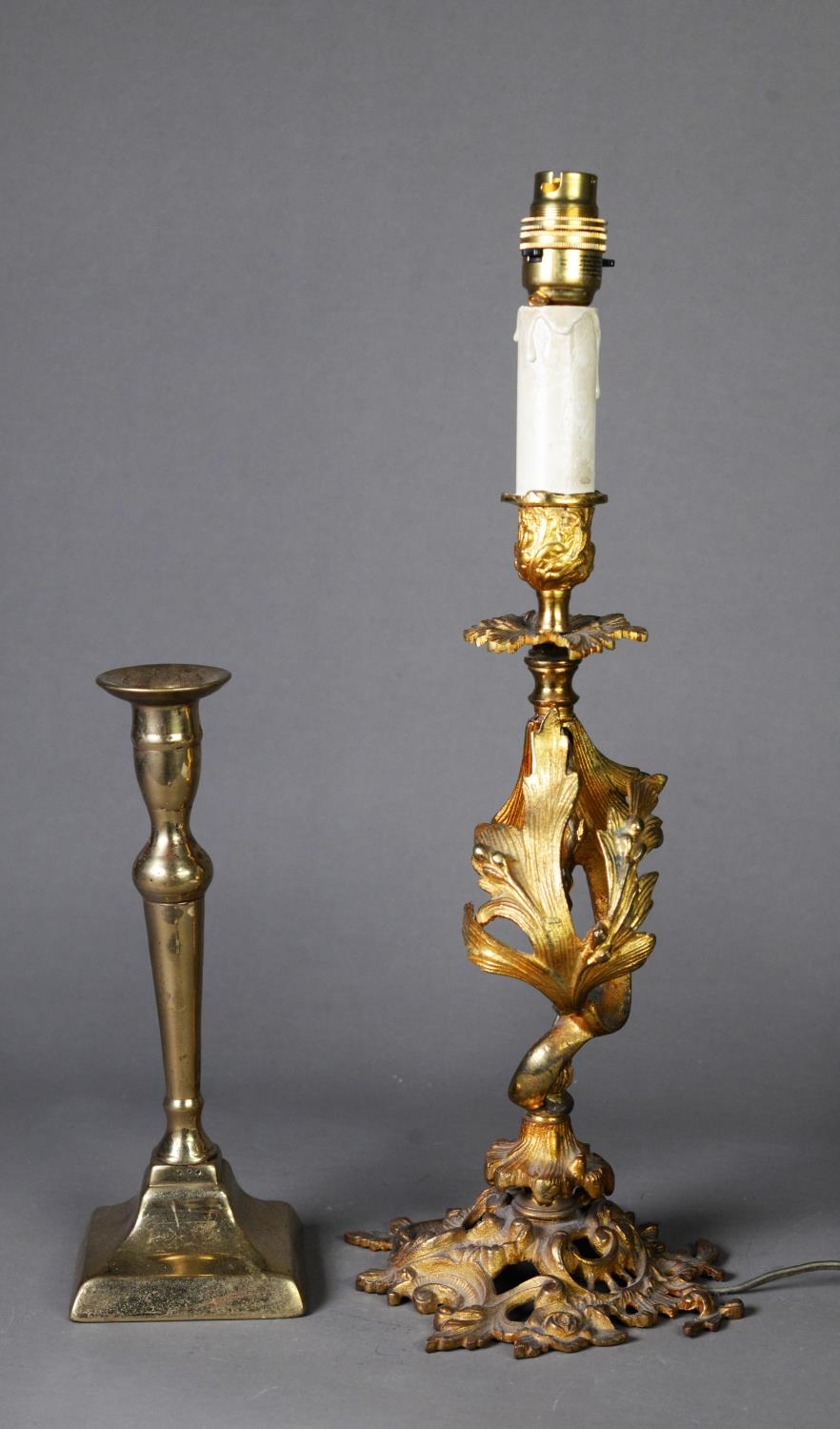 GILT METAL ROCOCO OPENWORK TABLE LAMP with foliate scroll column, leaf embossed urn shaped sconce