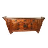 CHINESE STAINED AND CARVED ELM AND BEECH SIDEBOARD, the planked, oblong top with moulded ends, set