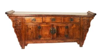 CHINESE STAINED AND CARVED ELM AND BEECH SIDEBOARD, the planked, oblong top with moulded ends, set