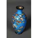 MEIJI PERIDO SMALL OVULAR CLOISONNE VASE decorated with a flowering shrub on a sky blue ground,