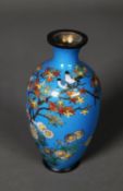 MEIJI PERIDO SMALL OVULAR CLOISONNE VASE decorated with a flowering shrub on a sky blue ground,