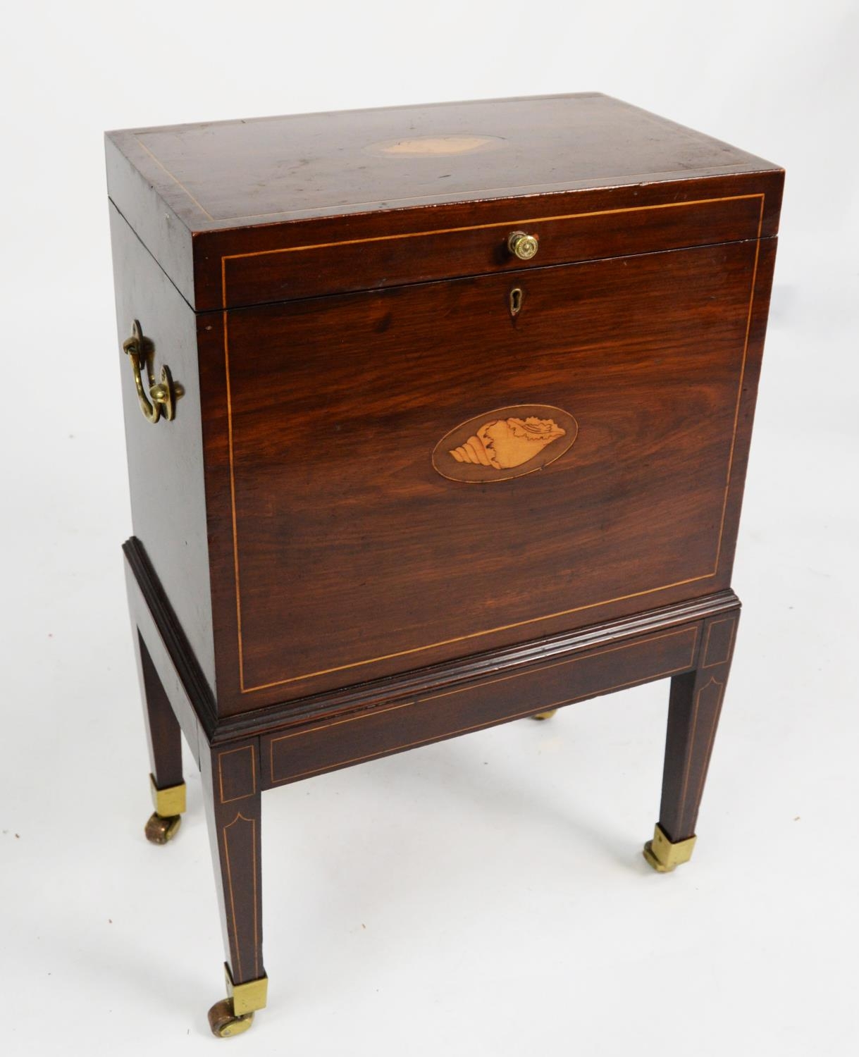 GEORGE III INLAID MAHOGANY CELLARETTE, the oblong top with oval shell inlay, set above a matching