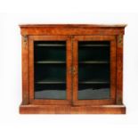 VICTORIAN INLAID AND FIGURED WALNUT DISPLAY CABINET WITH GILT METAL MOUNTS, the oblong top set above