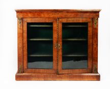 VICTORIAN INLAID AND FIGURED WALNUT DISPLAY CABINET WITH GILT METAL MOUNTS, the oblong top set above
