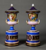 PAIR OF TWENTIETH CENTURY VIENNA PORCELAIN TWO HANDLED PEDESTAL VASES AND COVERS, each of campana