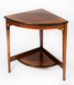 AN EDWARDIAN LINE INLAID ROSEWOOD CORNER TABLE, with under-shelf, on three square tapering legs, 2'