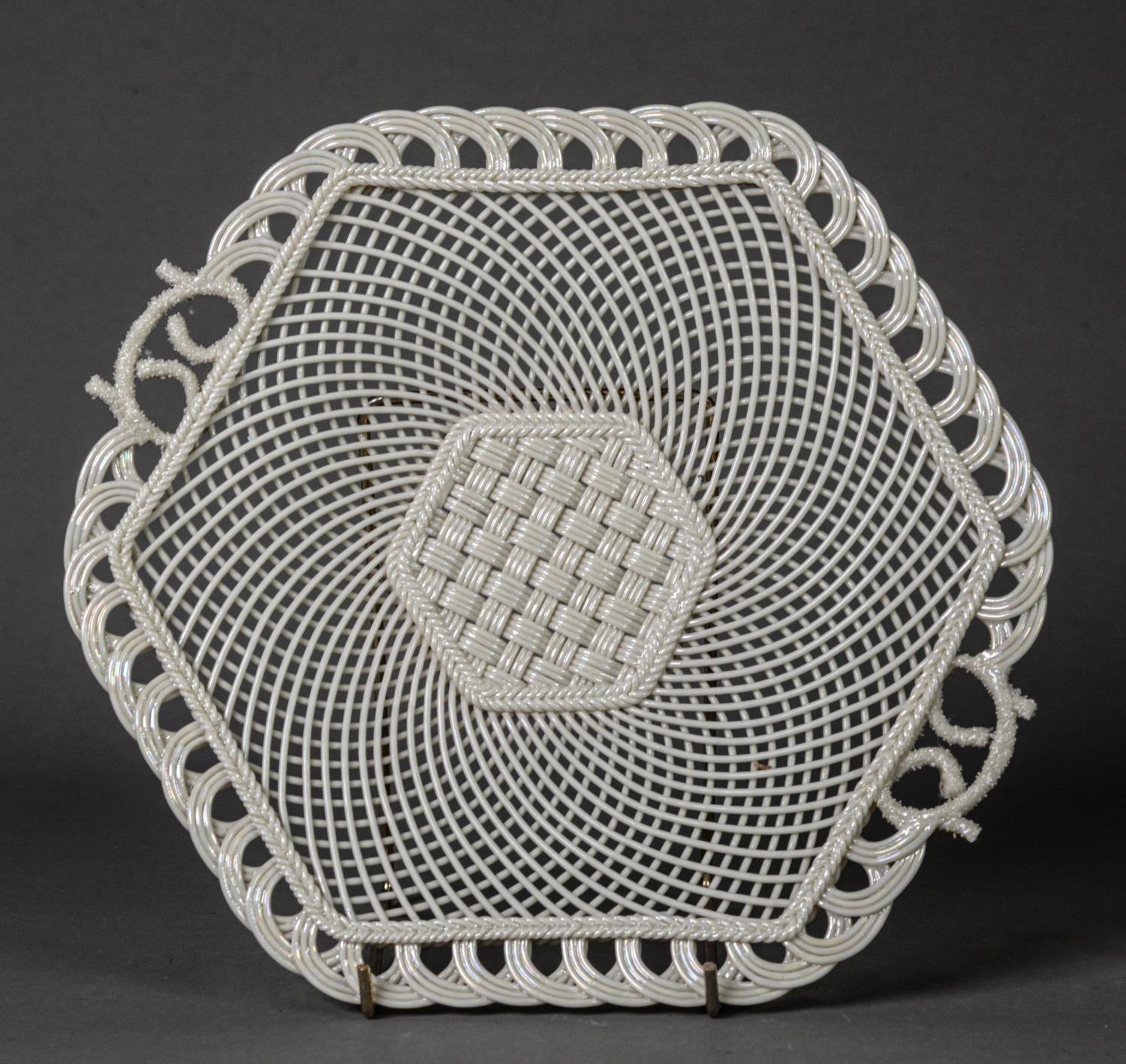 BELLEEK PORCELAIN TWO HANDLED SERVING PLATE, of hexagonal form with ozier pattern panel to the woven