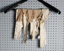TWO PAIRS OF VICTORIAN WHITE SOFT LEATHER GLOVES, approximately 24in (61cm) long; ANOTHER PAIR, 21in