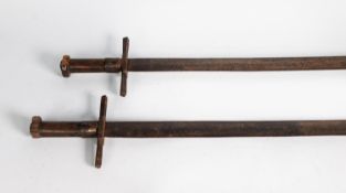 TWO, POSSIBLY NORTH AFRICAN, AGED SWORDS, with plain steel blades, cruciform guards and plain turned