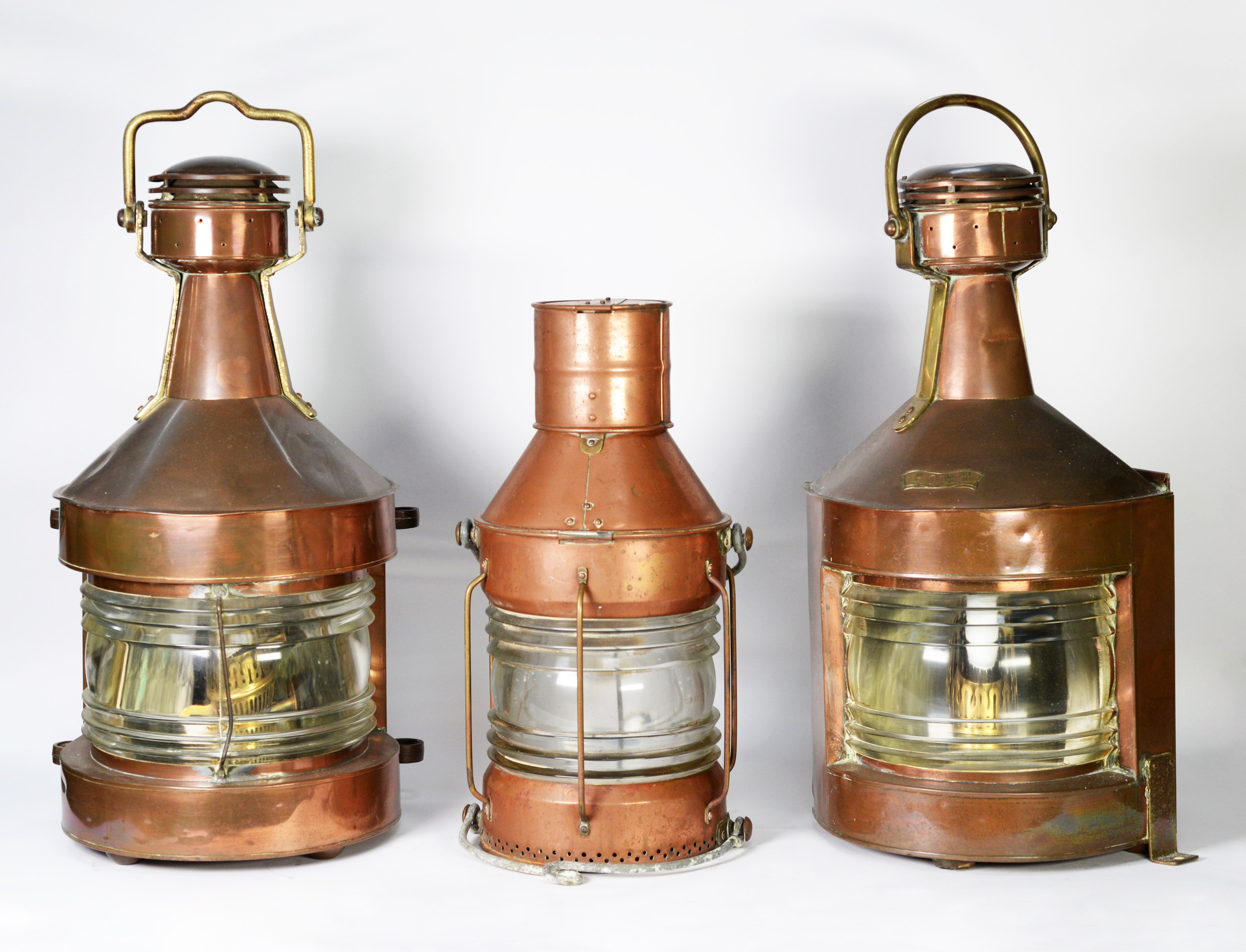 MARITIME INTEREST: three 20th century copper mast lamps, including a central lamp, port side lamp,