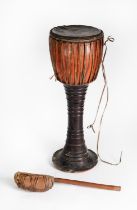 AFRICAN PAINTED WOODEN HIDE AND ANIMAL SKIN PEDESTAL DRUM, together with a wooden handled HIDE AND