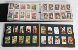 CIGARETTE CARD SLIP-IN ALBUM containing 12 sets of W.D. & H.O. WILLS, mainly 1920s & 1930s CIGARETTE