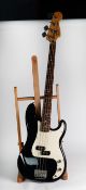 FENDER PRECISION BASS STYLE FOUR STRING ELECTRIC GUITAR, in black, bears Fender label and serial no: