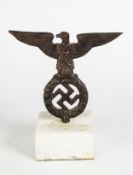 GERMAN THIRD REICH CAST IRON FLAG POLE CAP, in the form of a swastika within a wreath surmounted