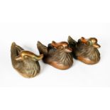 THREE CHINESE PATINATED COPPER ALLOY MODELS OF MANDARIN DUCKS, each bearing an embossed six
