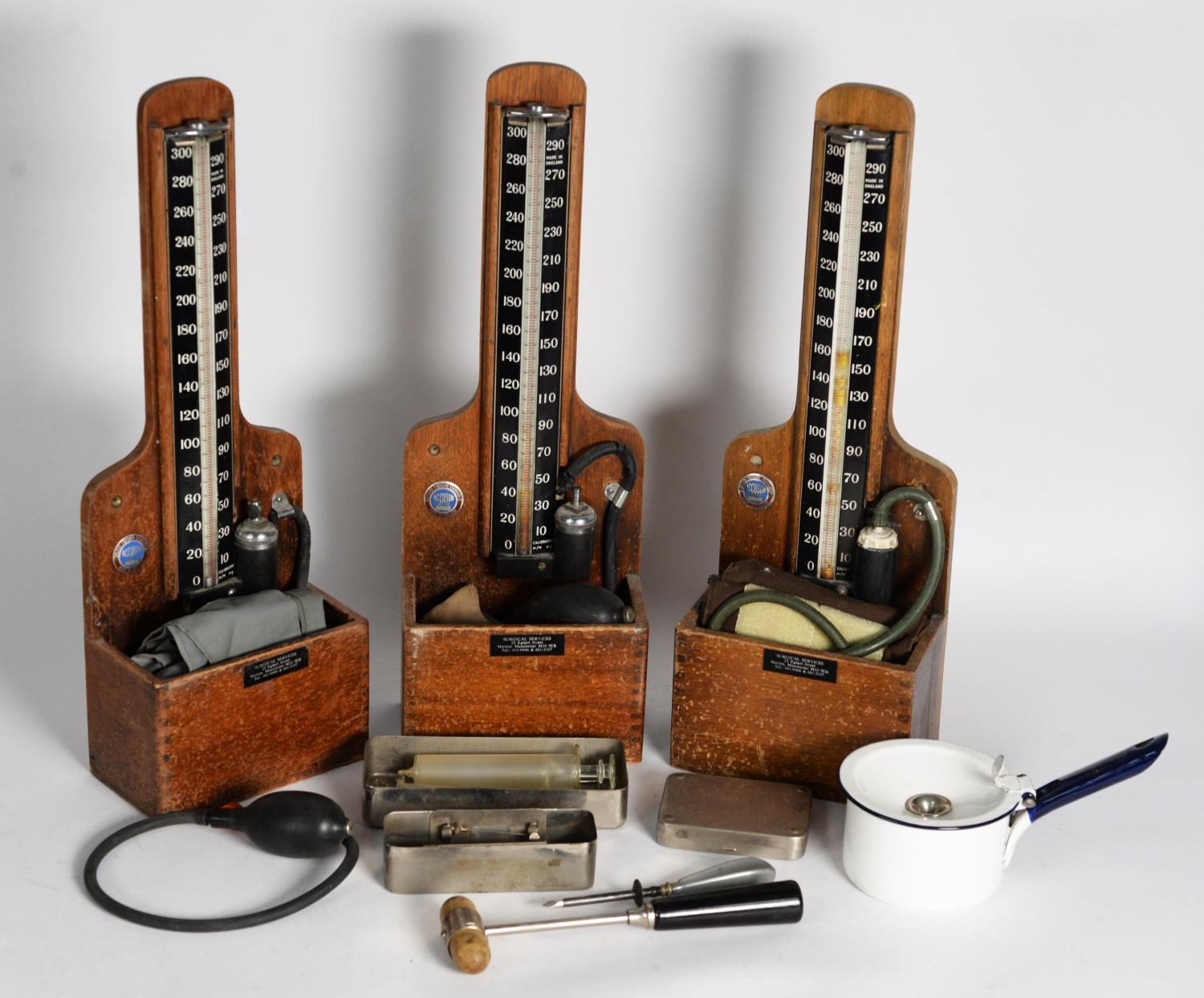 MEDICAL EQUIPMENT: Three vintage Accoson blood-pressure monitors, plus mid-century hypodermic