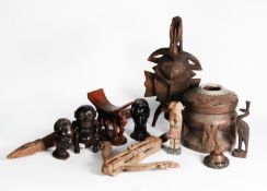 SELECTION OF SOME AGED AND LATER WOODEN OBJECTS to include African tribal masks; a circular