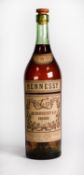 EMPTY LARGE BOTTLE OF HENNESSY COGNAC, with aged label and stained level. 19 ½” (49.5cm) high, never