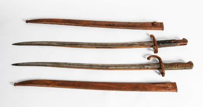 TWO LATE NINETEENTH CENTURY FRENCH BAYONETS IN STEEL SCABBARDS (2) C/R- considerable rusting to both