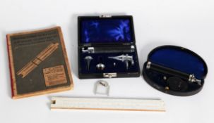 OPTHALMOSCOPE BY MAY, in case; AUROSCOPE with accessories, in case and a SLIDE RULE and