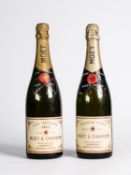 TWO BOTTLES OF MOET & CHANDON CHAMPAGNE, DRY IMPERIAL 1973, and PREMIER CUVEE, undated but similar