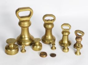 COLLECTION OF ELEVEN VINTAGE BRASS WEIGHTS, including SEVEN BELL SHAPED EXAMPLES, (11)