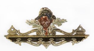 VICTORIAN CAST BRASS MURAL SIX-SLOT CUE RACK surmounted by a panel bust of a black boy, 13in (