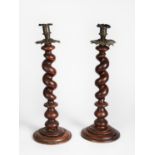 PAIR OF LARGE SPIRALLY TURNED TABLE CANDLESTICKS with metal sconces and pierced metal drip trays,