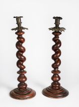 PAIR OF LARGE SPIRALLY TURNED TABLE CANDLESTICKS with metal sconces and pierced metal drip trays,