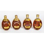 FOUR BOTTLES OF DIMPLE BLENDED SCOTCH WHISKY IN ORIGINAL CARD BOXES, two of which are triangular,