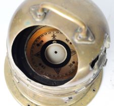 Brass ships binnacle with gimble mounted compass, the label to the side reads 'PATT.0183 B/R/62,