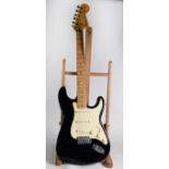 FENDER STRATOCASTER STYLE SIX STRING ELECTRIC GUITAR, in black, bears oblong white metal label to