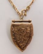 GOLD BACK AND FRONT FANCY SHIELD-SHAPED LOCKET PENDANT, with foliate engraved decoration, on a 9CT