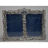 LATE VICTORIAN CAST SILVER DOUBLE PHOTOGRAPH FRAME, with Mermaids, Amorini, a Satyr and other