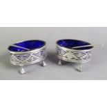 PAIR OF VICTORIAN PIERCED SILVER OPEN SALTS BY CHARLES STUART HARRIS, each of oval form with wavy