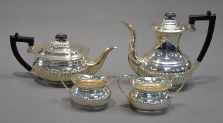 FOUR PIECE GEORGIAN STYLE ELECTROPLATED TEA AND COFFEE SET, of part fluted, rounded oblong form with