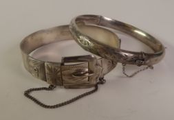 SILVER BANGLE, the top of engraved strap pattern with hinged buckle clasp, Birmingham 1975 and an