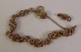 9CT GOLD FANCY LINK BRACELET, lover's knots tied by rope hoops and alternating with hoop links,