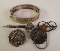 TWO SMALL CELTIC SILVER BROOCHES, 2.3cm diameter; a SCOTTISH SILVER AND HARDSTONE DIRK BROOCH, 5cm