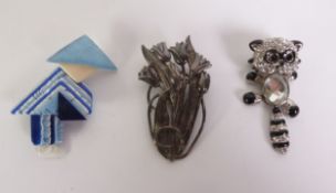 LEA STEIN, PARIS, SMALL PLASTIC BROOCH in the form of a Chinese figure and TWO OTHER BROOCHES, one