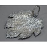 FOREIGN, UNMARKED SILVER COLOURED METAL LEAF SHAPED DISH, profusely embossed with flowering leafy