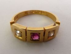 VICTORIAN 18CT GOLD RUBY AND DIAMOND RING, a cushion-cut ruby and two old-cut diamonds in square