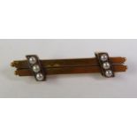 VICTORIAN SEED PEARL BAR BROOCH, a double bar with beaded terminals and set with groups of seed