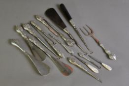 COLLECTION OF TWELVE VANITY OR OCCASIONAL ITEMS WITH FILLED SILVER HANDLES, comprising: TWO PAIRS OF