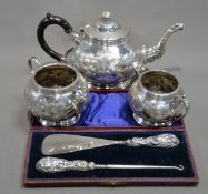 EARLY TWENTIETH CENTURY ELECTRO-PLATED THREE PIECE TEA SERVICE, also a CASED FILLED SILVER HANDLED
