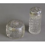 TWO EDWARD VII CUT GLASS TOILET JARS WITH EMBOSSED SILVER PULL-OFF COVERS, Birmingham 1901 and