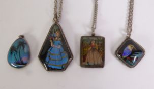 FOUR SILVER AND BUTTERFLY WING PICTORIAL PENDANTS, three on fine chain necklaces, circa 1920s/