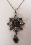 ARTS & CRAFTS SILVER MOONSTONE AND GREEN TOURMALINE PENDANT ON CHAIN, an oval-cut green tourmaline