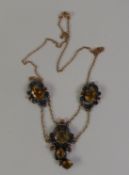 ARTS & CRAFTS CITRINE PENDANT NECKLACE, the central pendant with a kite-cut citrine and two