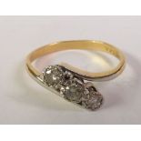 THREE STONE DIAMOND CROSSOVER RING, graduated round-cut diamonds in illusion settings to crossover